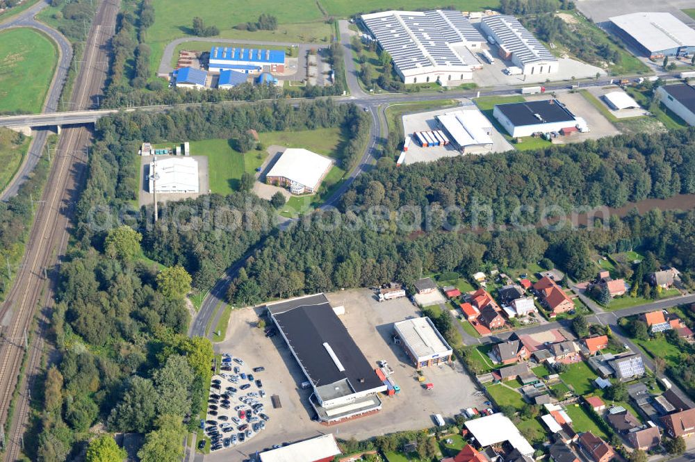 Aerial photograph Papenburg / Niedersachsen - Blick auf das Firmengelände der Hermann Bunte GmbH & Co. KG im Gewerbegebiet an der Bahnhofstraße in Papenburg. Das Unternehmen erstellt Service- Reparatur- und Wartungsdienstleistungen im Kraftfahrzeug ( Marke Mercedes Benz) und Nutzfahrzeugbereich. Zu den Geschäftsbereichen der auf mehrere Standorte verteilten Unternehmensgruppe gehört auch das Betreiben einer LKW - Spedition. Premises of the Hermann GmbH & Co. KG in the industrial area in Papenburg / Lower Saxony.