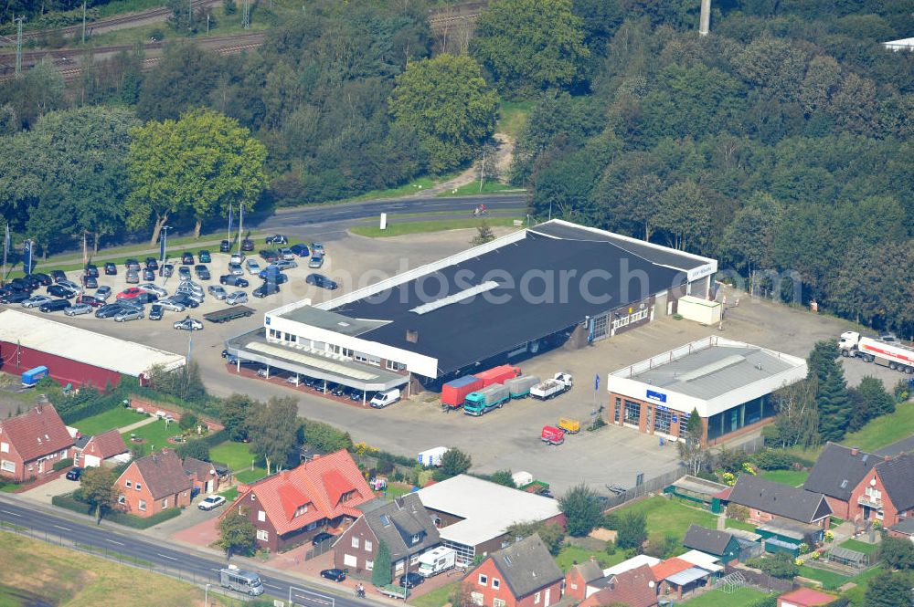 Aerial image Papenburg / Niedersachsen - Blick auf das Firmengelände der Hermann Bunte GmbH & Co. KG im Gewerbegebiet an der Bahnhofstraße in Papenburg. Das Unternehmen erstellt Service- Reparatur- und Wartungsdienstleistungen im Kraftfahrzeug ( Marke Mercedes Benz) und Nutzfahrzeugbereich. Zu den Geschäftsbereichen der auf mehrere Standorte verteilten Unternehmensgruppe gehört auch das Betreiben einer LKW - Spedition. Premises of the Hermann GmbH & Co. KG in the industrial area in Papenburg / Lower Saxony.