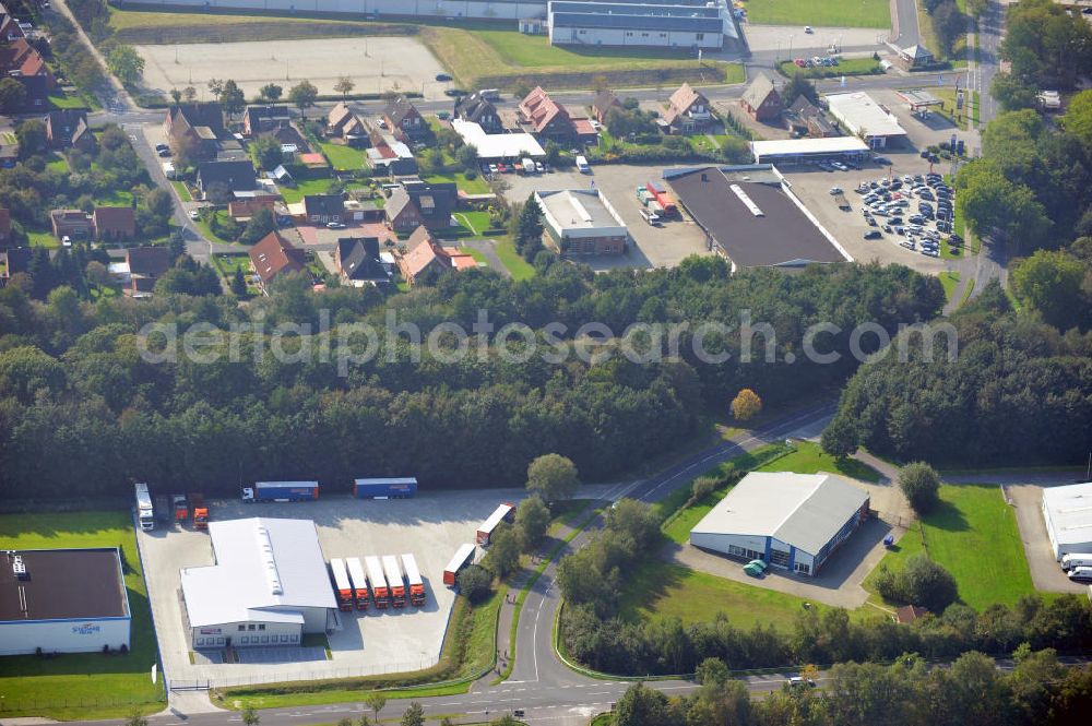 Aerial photograph Papenburg / Niedersachsen - Blick auf das Firmengelände der Hermann Bunte GmbH & Co. KG im Gewerbegebiet an der Bahnhofstraße in Papenburg. Das Unternehmen erstellt Service- Reparatur- und Wartungsdienstleistungen im Kraftfahrzeug ( Marke Mercedes Benz) und Nutzfahrzeugbereich. Zu den Geschäftsbereichen der auf mehrere Standorte verteilten Unternehmensgruppe gehört auch das Betreiben einer LKW - Spedition. Premises of the Hermann GmbH & Co. KG in the industrial area in Papenburg / Lower Saxony.