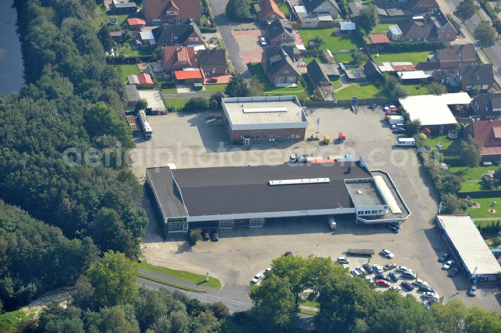 Aerial photograph Papenburg / Niedersachsen - Blick auf das Firmengelände der Hermann Bunte GmbH & Co. KG im Gewerbegebiet an der Bahnhofstraße in Papenburg. Das Unternehmen erstellt Service- Reparatur- und Wartungsdienstleistungen im Kraftfahrzeug ( Marke Mercedes Benz) und Nutzfahrzeugbereich. Zu den Geschäftsbereichen der auf mehrere Standorte verteilten Unternehmensgruppe gehört auch das Betreiben einer LKW - Spedition. Premises of the Hermann GmbH & Co. KG in the industrial area in Papenburg / Lower Saxony.