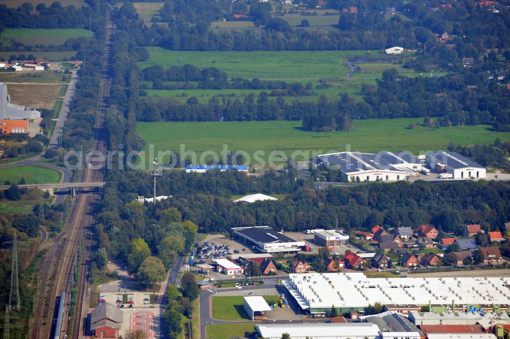 Papenburg / Niedersachsen from the bird's eye view: Blick auf das Firmengelände der Hermann Bunte GmbH & Co. KG im Gewerbegebiet an der Bahnhofstraße in Papenburg. Das Unternehmen erstellt Service- Reparatur- und Wartungsdienstleistungen im Kraftfahrzeug ( Marke Mercedes Benz) und Nutzfahrzeugbereich. Zu den Geschäftsbereichen der auf mehrere Standorte verteilten Unternehmensgruppe gehört auch das Betreiben einer LKW - Spedition. Premises of the Hermann GmbH & Co. KG in the industrial area in Papenburg / Lower Saxony.