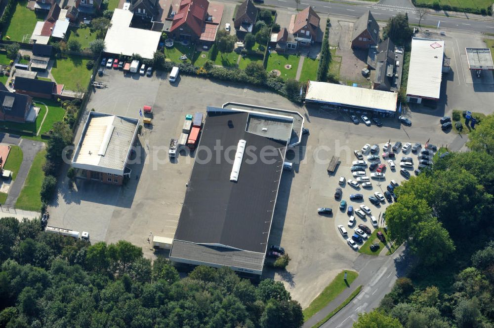 Aerial image Papenburg / Niedersachsen - Blick auf das Firmengelände der Hermann Bunte GmbH & Co. KG im Gewerbegebiet an der Bahnhofstraße in Papenburg. Das Unternehmen erstellt Service- Reparatur- und Wartungsdienstleistungen im Kraftfahrzeug ( Marke Mercedes Benz) und Nutzfahrzeugbereich. Zu den Geschäftsbereichen der auf mehrere Standorte verteilten Unternehmensgruppe gehört auch das Betreiben einer LKW - Spedition. Premises of the Hermann GmbH & Co. KG in the industrial area in Papenburg / Lower Saxony.