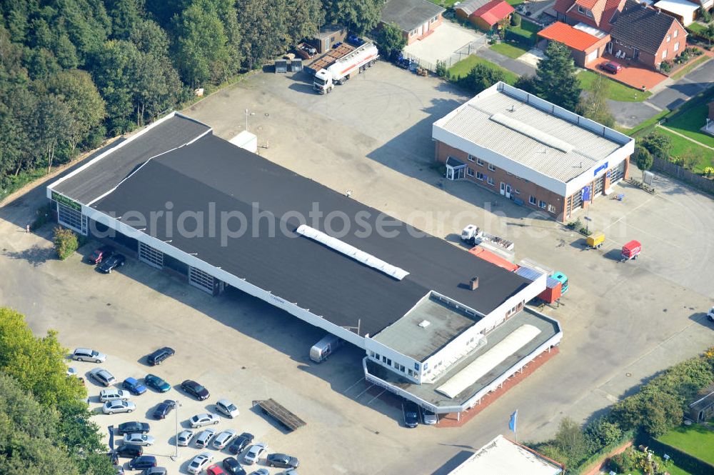 Papenburg / Niedersachsen from the bird's eye view: Blick auf das Firmengelände der Hermann Bunte GmbH & Co. KG im Gewerbegebiet an der Bahnhofstraße in Papenburg. Das Unternehmen erstellt Service- Reparatur- und Wartungsdienstleistungen im Kraftfahrzeug ( Marke Mercedes Benz) und Nutzfahrzeugbereich. Zu den Geschäftsbereichen der auf mehrere Standorte verteilten Unternehmensgruppe gehört auch das Betreiben einer LKW - Spedition. Premises of the Hermann GmbH & Co. KG in the industrial area in Papenburg / Lower Saxony.