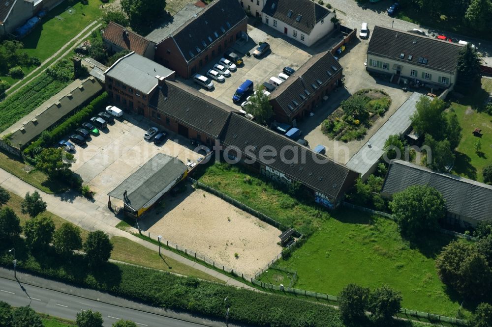 Aerial photograph Berlin - Company area in the historical city centre Old - Marzahn with halls, company buildings and production plants in the district Marzahn-cent village in Berlin, Germany