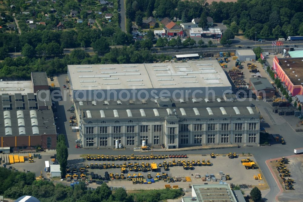 Hannover from above - Company compound of Komatsu Hanomag GmbH in the Linden-South part of Hannover in the state of Lower Saxony. The construction vehicle production company includes a large work and production facility on Hanomagstrasse in the industrial area of the borough. The vehicles are distinctly coloured in yellow