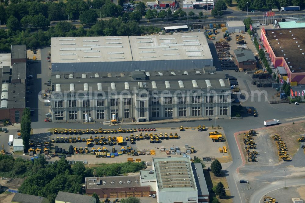 Hannover from the bird's eye view: Company compound of Komatsu Hanomag GmbH in the Linden-South part of Hannover in the state of Lower Saxony. The construction vehicle production company includes a large work and production facility on Hanomagstrasse in the industrial area of the borough. The vehicles are distinctly coloured in yellow