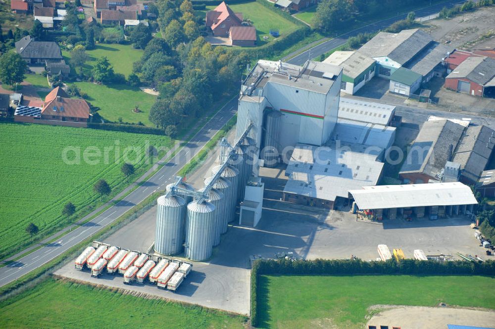 Aerial photograph Bawinkel - Blick auf das Firmengelände des Landhandels und Kraftfutterwerk der Tihen GmbH & Co KG in Bawinkel / Niedersachsen. Die Marke TIBA Kraftfutter ist in der deutschen und europäischen Tierzucht und Landwirtschaft weit verbreitet. Premises of Tihen GmbH & Co KG in Bawinkel / Lower Saxony. The brand TIBA feed is in the German and European animal breeding and farming is widespread.