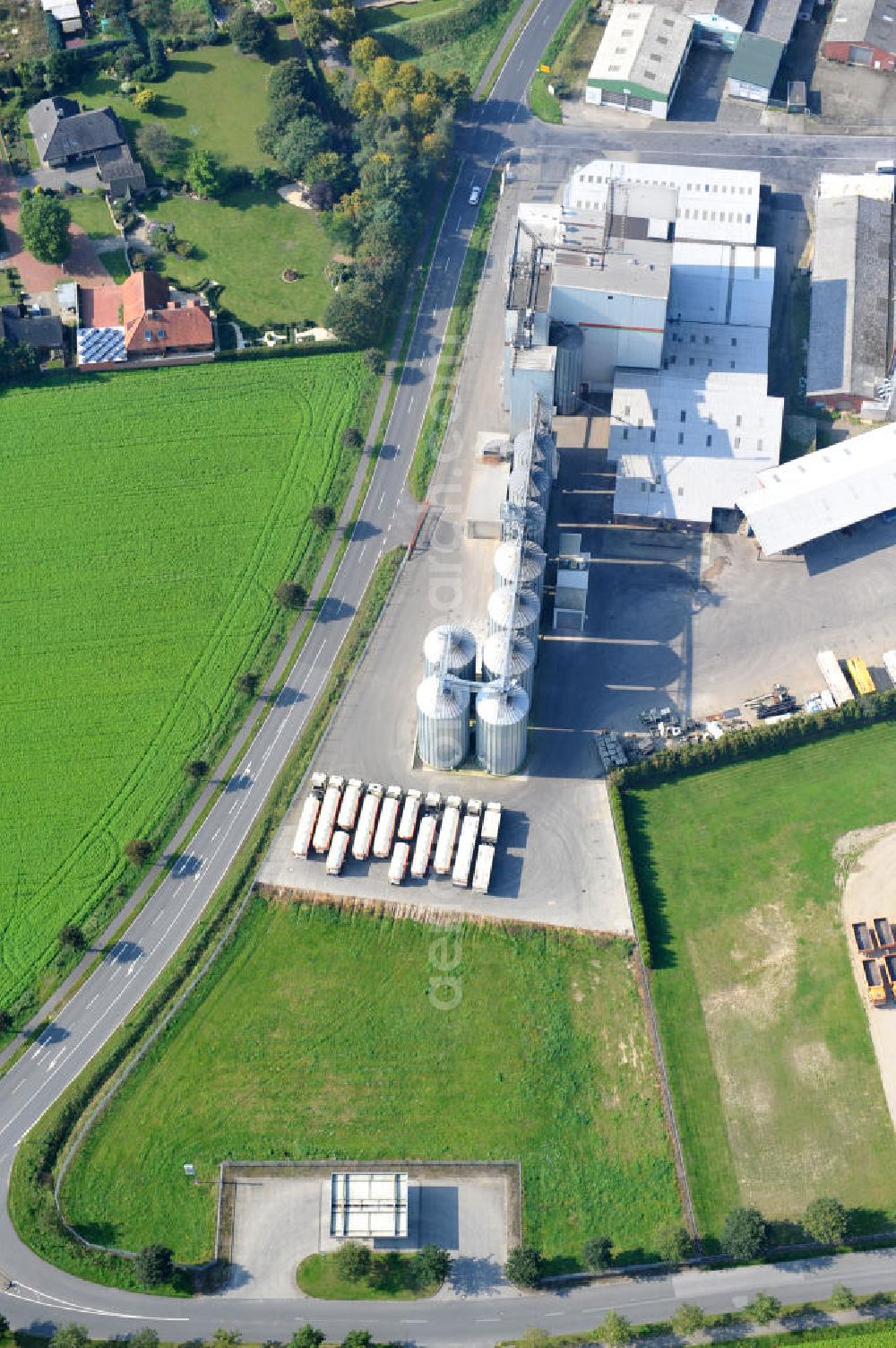 Aerial image Bawinkel - Blick auf das Firmengelände des Landhandels und Kraftfutterwerk der Tihen GmbH & Co KG in Bawinkel / Niedersachsen. Die Marke TIBA Kraftfutter ist in der deutschen und europäischen Tierzucht und Landwirtschaft weit verbreitet. Premises of Tihen GmbH & Co KG in Bawinkel / Lower Saxony. The brand TIBA feed is in the German and European animal breeding and farming is widespread.