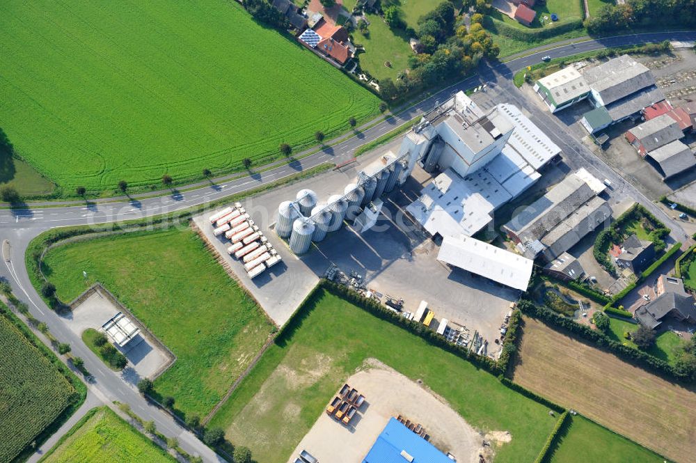 Aerial photograph Bawinkel - Blick auf das Firmengelände des Landhandels und Kraftfutterwerk der Tihen GmbH & Co KG in Bawinkel / Niedersachsen. Die Marke TIBA Kraftfutter ist in der deutschen und europäischen Tierzucht und Landwirtschaft weit verbreitet. Premises of Tihen GmbH & Co KG in Bawinkel / Lower Saxony. The brand TIBA feed is in the German and European animal breeding and farming is widespread.