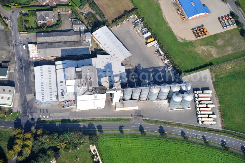 Aerial photograph Bawinkel - Blick auf das Firmengelände des Landhandels und Kraftfutterwerk der Tihen GmbH & Co KG in Bawinkel / Niedersachsen. Die Marke TIBA Kraftfutter ist in der deutschen und europäischen Tierzucht und Landwirtschaft weit verbreitet. Premises of Tihen GmbH & Co KG in Bawinkel / Lower Saxony. The brand TIBA feed is in the German and European animal breeding and farming is widespread.