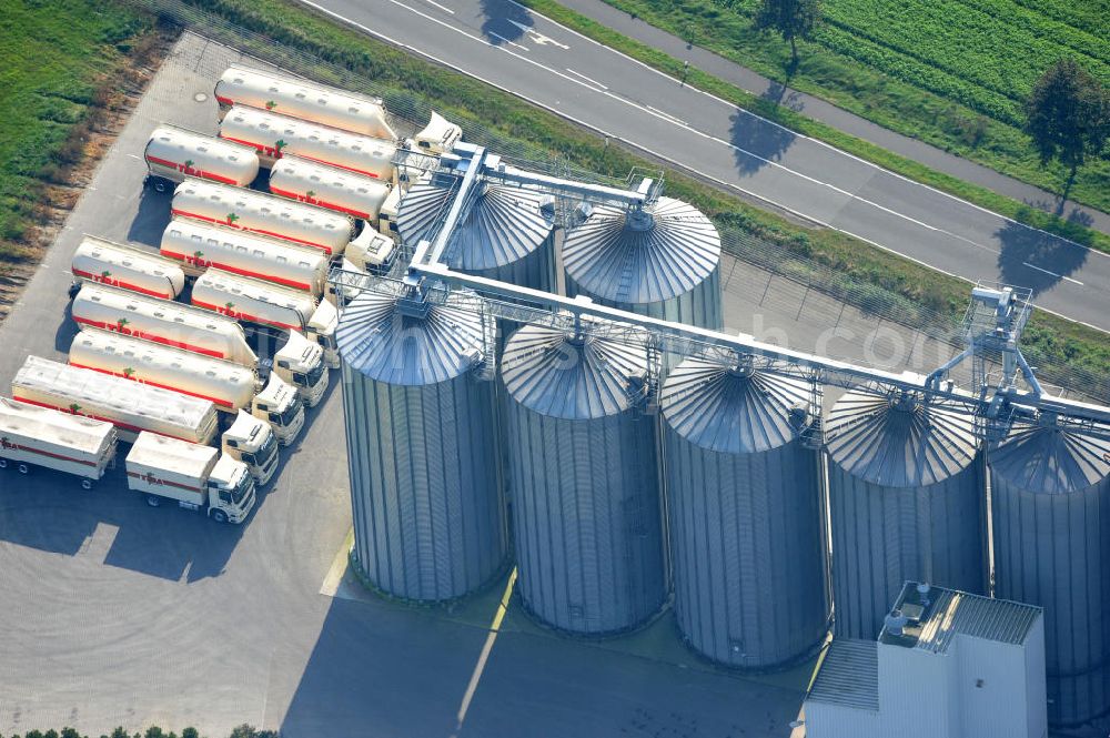 Aerial photograph Bawinkel - Blick auf das Firmengelände des Landhandels und Kraftfutterwerk der Tihen GmbH & Co KG in Bawinkel / Niedersachsen. Die Marke TIBA Kraftfutter ist in der deutschen und europäischen Tierzucht und Landwirtschaft weit verbreitet. Premises of Tihen GmbH & Co KG in Bawinkel / Lower Saxony. The brand TIBA feed is in the German and European animal breeding and farming is widespread.