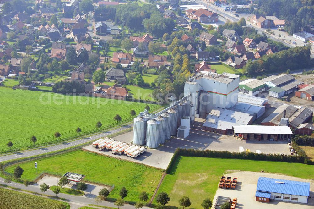 Aerial photograph Bawinkel - Blick auf das Firmengelände des Landhandels und Kraftfutterwerk der Tihen GmbH & Co KG in Bawinkel / Niedersachsen. Die Marke TIBA Kraftfutter ist in der deutschen und europäischen Tierzucht und Landwirtschaft weit verbreitet. Premises of Tihen GmbH & Co KG in Bawinkel / Lower Saxony. The brand TIBA feed is in the German and European animal breeding and farming is widespread.