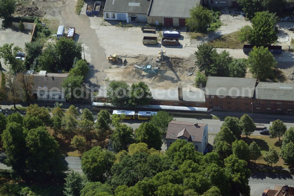 Berlin from above - Company and industrial compound in the Biesdorf part of the district of Marzahn-Hellersdorf in Berlin in Germany. Construction works are taking place on the compound between Alt Biesdorf and Weissenhoeher Strasse streets, where several industrial buildings, workshops and shops are located