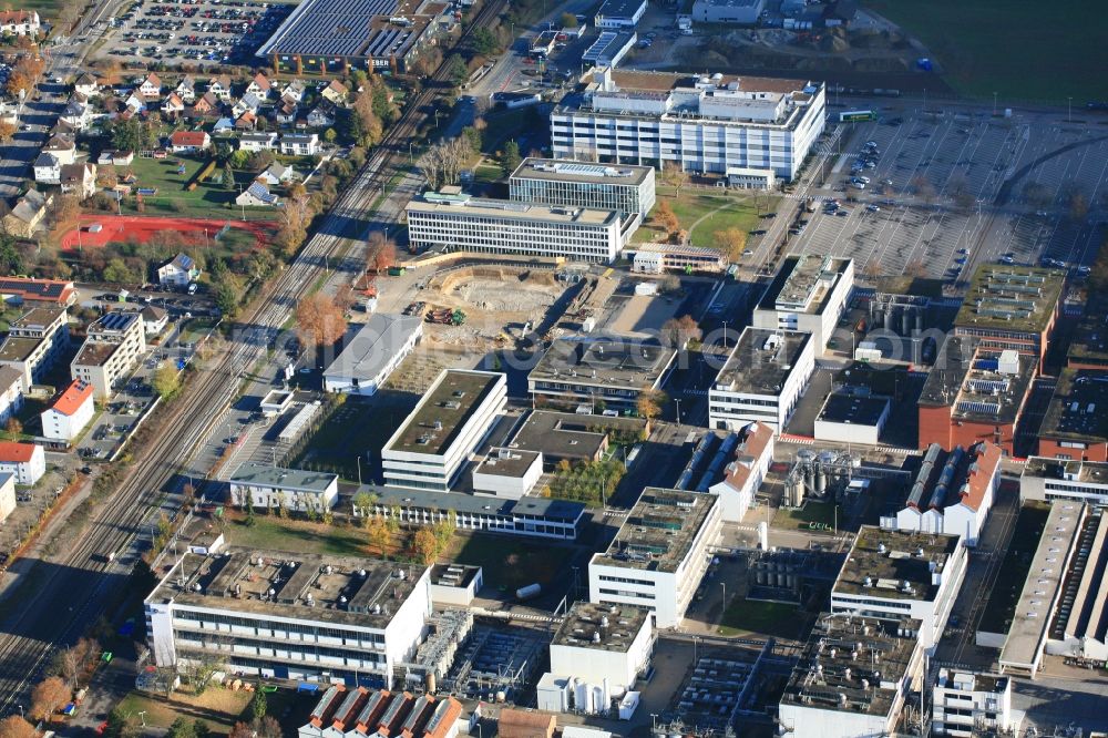 Grenzach-Wyhlen from the bird's eye view: Company grounds and facilities of Roche Pharma with construction site of the new FOB, Flexible Office Building, in Grenzach-Wyhlen in the state Baden-Wurttemberg, Germany