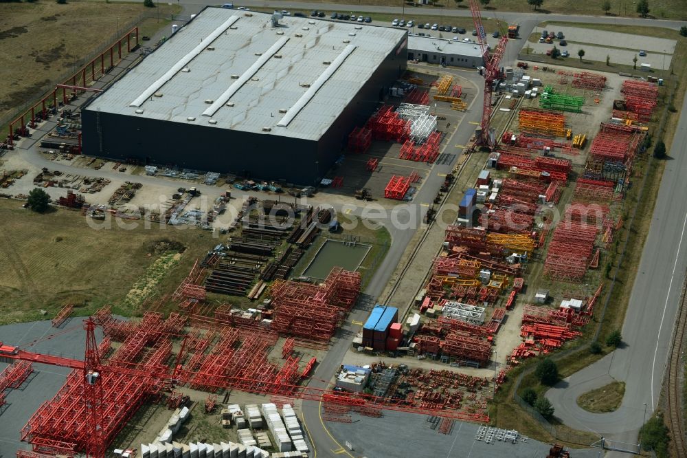 Luckau from the bird's eye view: Company grounds and facilities of the Wolffkran works in Luckau in the state of Brandenburg. Tower cranes are being produced on site with the large outdoor facilities