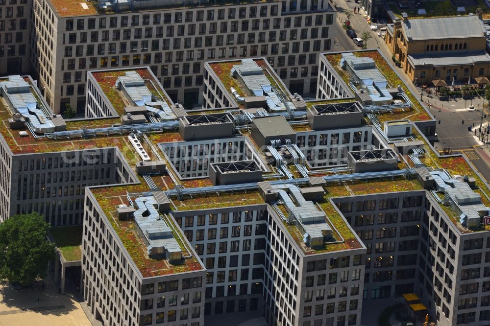 Berlin from the bird's eye view: The building in form of a comb is the company headquarters of the DB International GmbH and the DB Bahnservice GmbH on the Elisabeth-Schwarzhaupt-Platz in Berlin-Mitte. The roof area is green