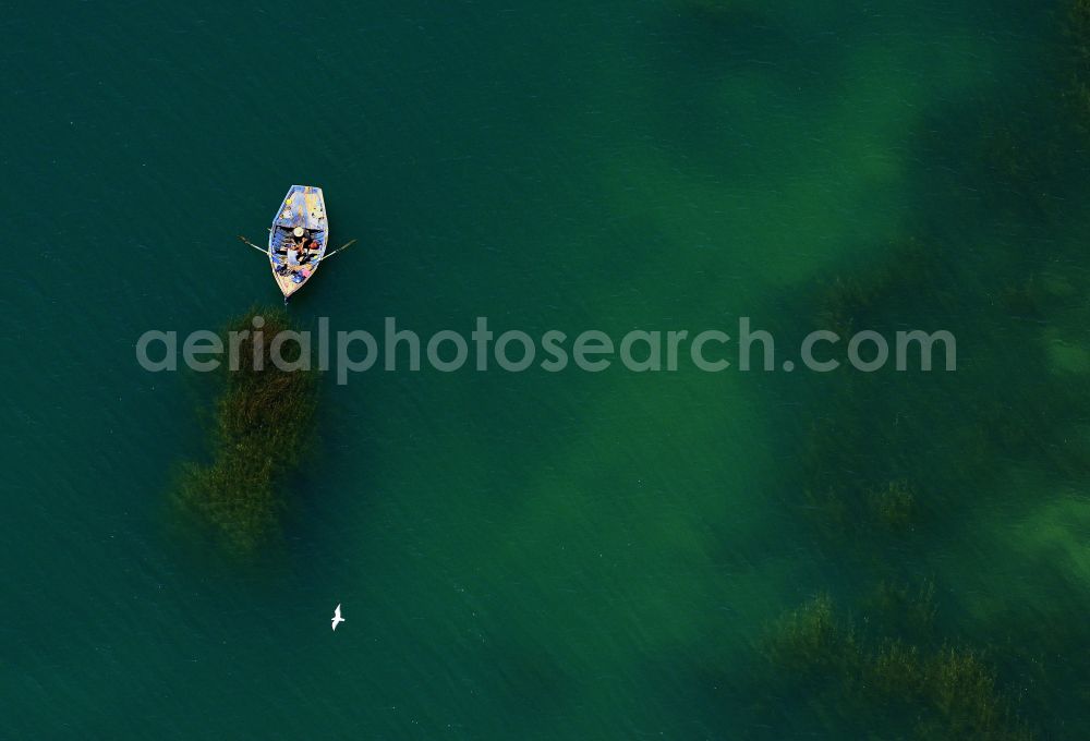 Aerial image Zaouiet Sidi Ali Ben Nouini - Reservoir and fishing boat in the reservoir Barrage Al Massira in Zaouiet Sidi Ali Ben Nouini in Marrakech-Safi, Morocco