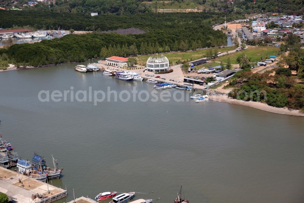 Aerial image Ratsada - Fishing port of Ratsada on Phuket Island in Thailand. There are numerous fishing boats and ships in him. The port is also the starting point for ferries and excursion boats to neighboring islands