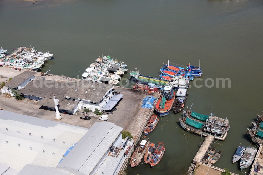 Ratsada from above - Fishing port of Ratsada on Phuket Island in Thailand. There are numerous fishing boats and ships in him. The port is also the starting point for ferries and excursion boats to neighboring islands