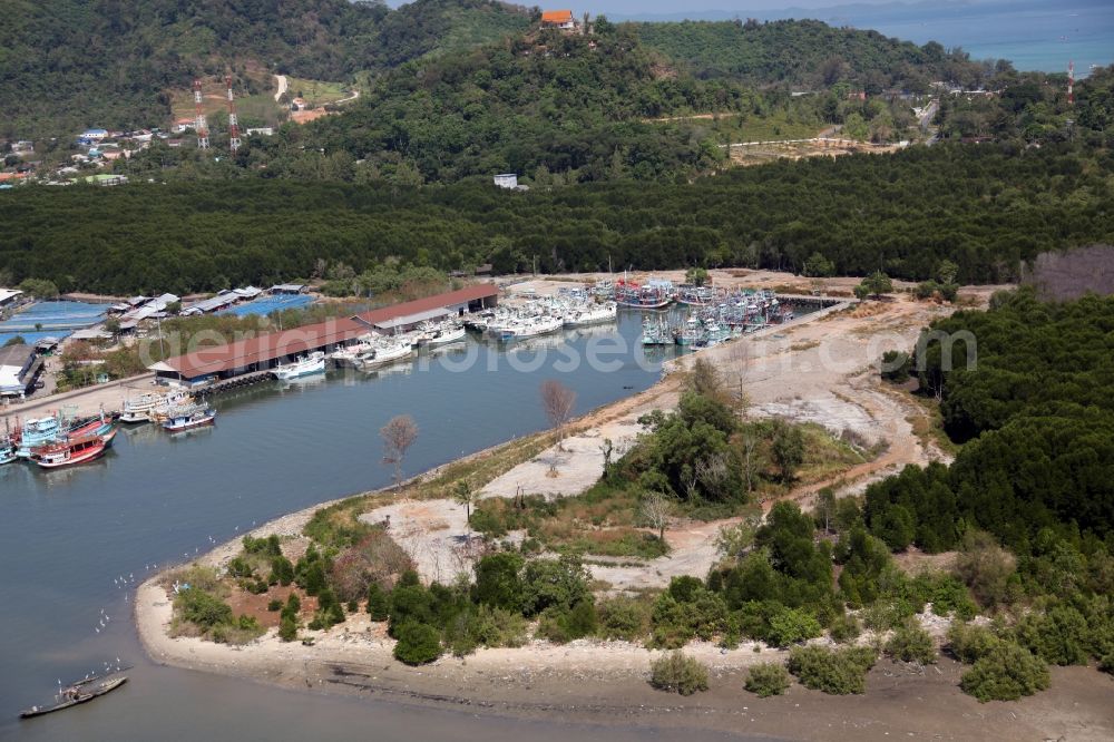 Aerial image Ratsada - Fishing port of Ratsada on Phuket Island in Thailand. There are numerous fishing boats and ships in him. The port is also the starting point for ferries and excursion boats to neighboring islands