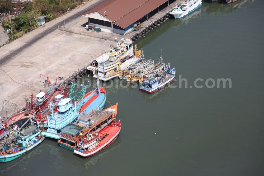 Ratsada from above - Fishing port of Ratsada on Phuket Island in Thailand. There are numerous fishing boats and ships in him. The port is also the starting point for ferries and excursion boats to neighboring islands