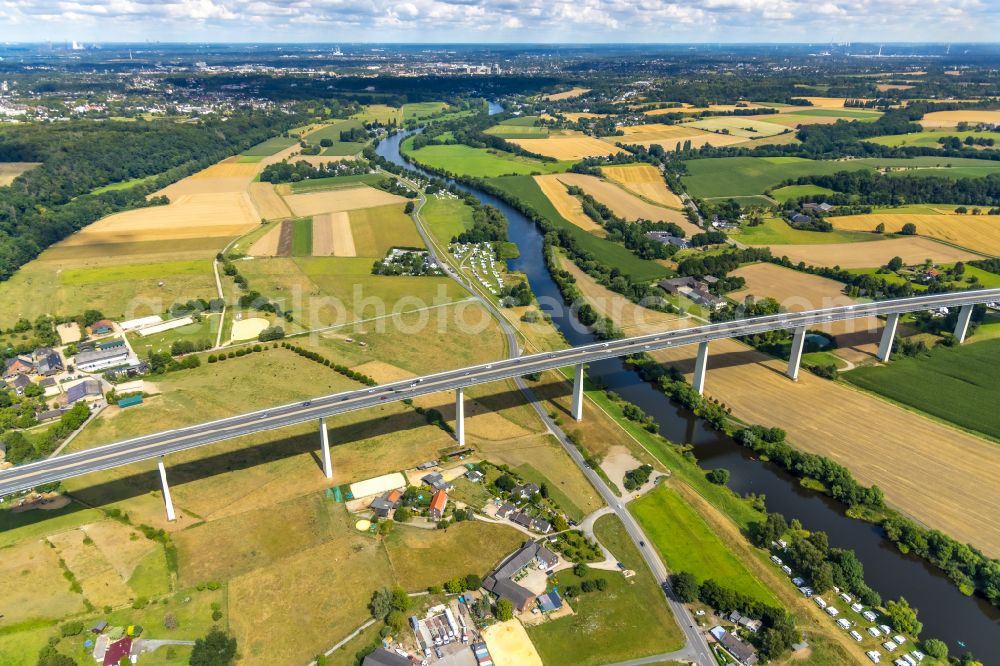 Mintard from above - Fisheye perspective Routing and traffic lanes over the highway bridge in the motorway A 52 over the shore of river Ruhr in Muelheim on the Ruhr in the state North Rhine-Westphalia, Germany