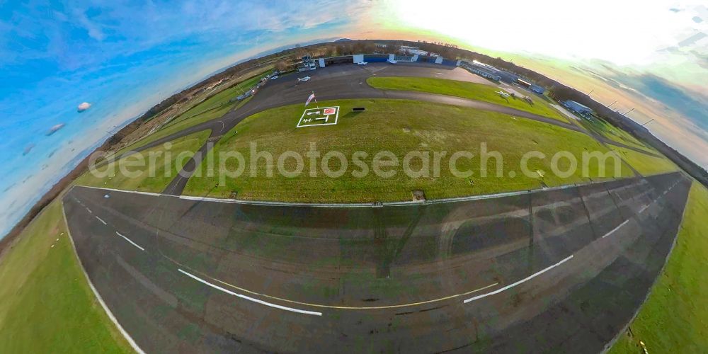 Hünxe from the bird's eye view: Fisheye perspective runway with tarmac terrain of airfield Flugplatz Schwarze Heide in Huenxe in the state North Rhine-Westphalia, Germany