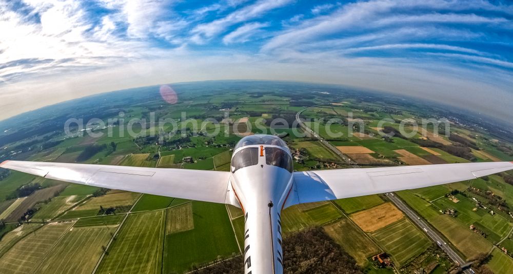 Süddinker from the bird's eye view: Fisheye perspective - Diamond HK36 Super Dimona Aircraft in flight over the airspace in Sueddinker at Ruhrgebiet in the state North Rhine-Westphalia, Germany