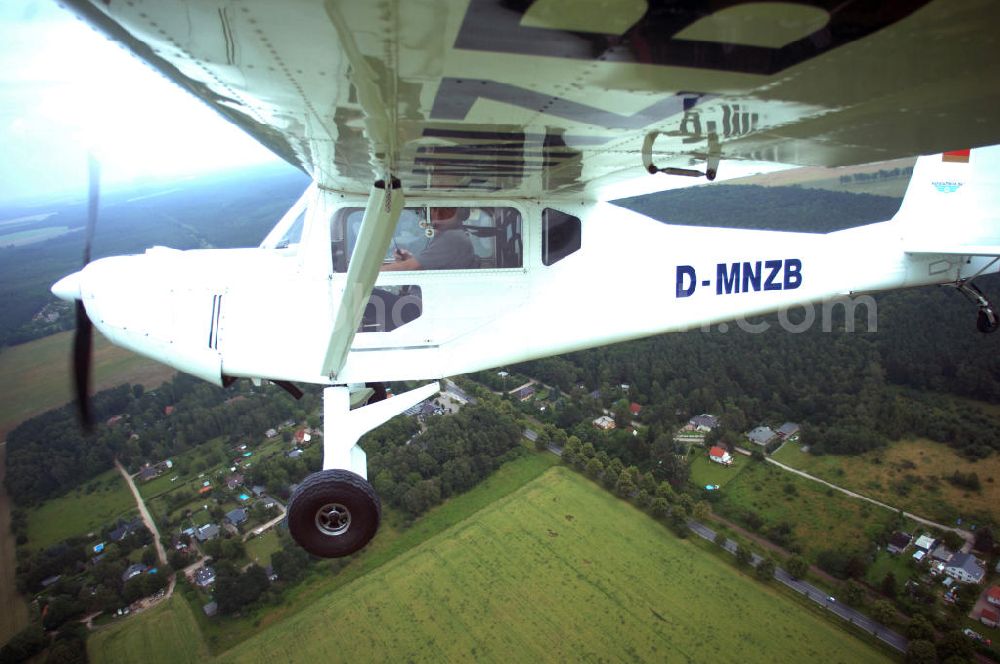 Aerial image Werneuchen - Fisheye-Perspektive auf das Ultraleichtflugzeug WT-01 der Agentur bei einem Flug in der Nähe des Flugplatzes Werneuchen.