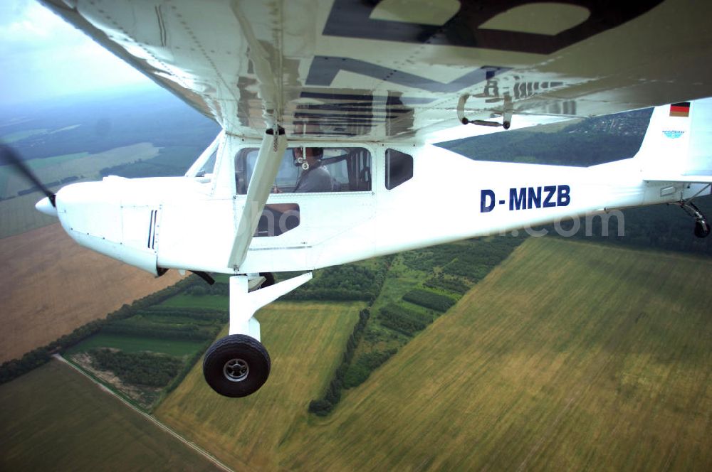 Aerial photograph Werneuchen - Fisheye-Perspektive auf das Ultraleichtflugzeug WT-01 der Agentur bei einem Flug in der Nähe des Flugplatzes Werneuchen.