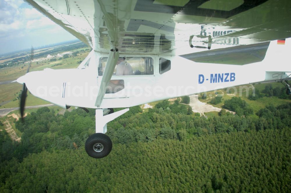 Aerial image Werneuchen - Fisheye-Perspektive auf das Ultraleichtflugzeug WT-01 der Agentur bei einem Flug in der Nähe des Flugplatzes Werneuchen.