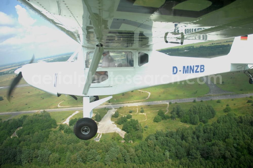 Aerial photograph Werneuchen - Fisheye-Perspektive auf das Ultraleichtflugzeug WT-01 der Agentur bei einem Flug in der Nähe des Flugplatzes Werneuchen.