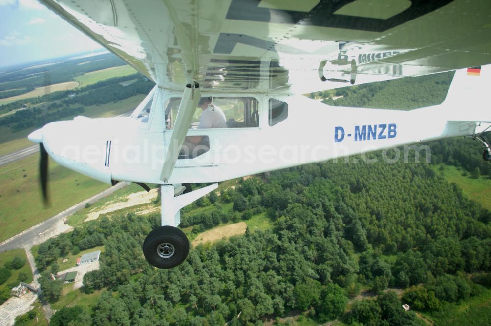 Aerial photograph Werneuchen - Fisheye-Perspektive auf das Ultraleichtflugzeug WT-01 der Agentur bei einem Flug in der Nähe des Flugplatzes Werneuchen.