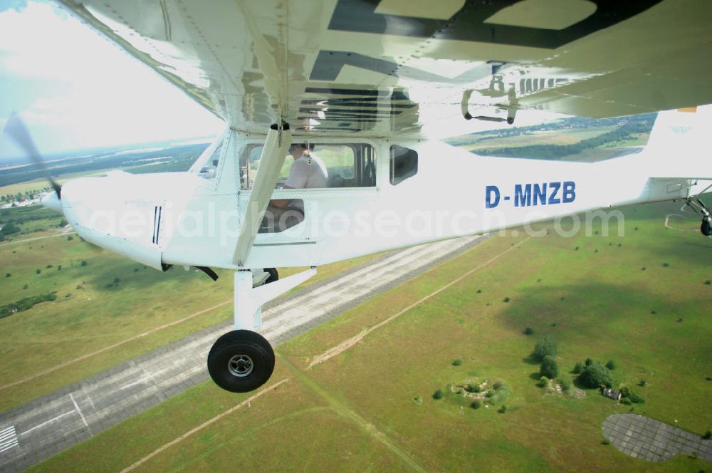 Aerial image Werneuchen - Fisheye-Perspektive auf das Ultraleichtflugzeug WT-01 der Agentur bei einem Flug in der Nähe des Flugplatzes Werneuchen.