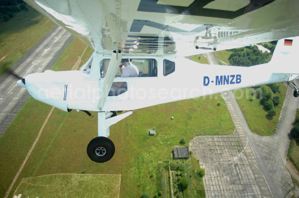 Aerial photograph Werneuchen - Fisheye-Perspektive auf das Ultraleichtflugzeug WT-01 der Agentur bei einem Flug in der Nähe des Flugplatzes Werneuchen.