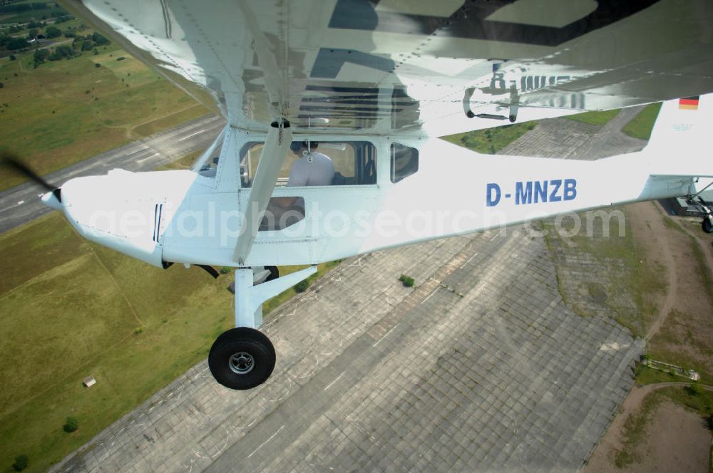 Aerial photograph Werneuchen - Fisheye-Perspektive auf das Ultraleichtflugzeug WT-01 der Agentur bei einem Flug in der Nähe des Flugplatzes Werneuchen.