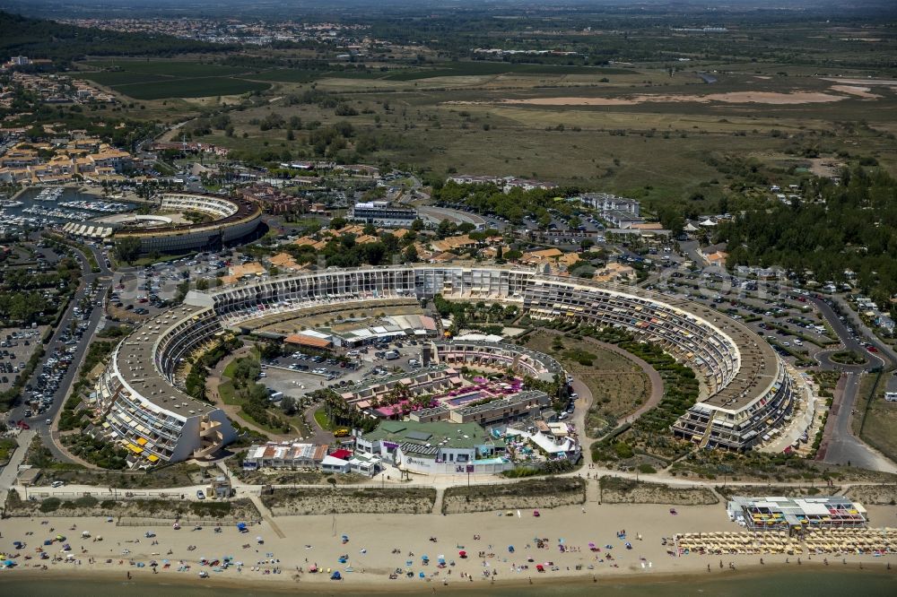 Agde from the bird's eye view: Naturist nudist sunbathing nudists and hotel complex on the Mediterranean beach of Agde in the province of Languedoc-Roussillon in France