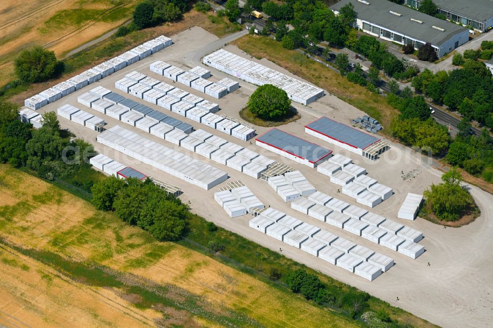 Berlin from above - Container settlement as temporary shelter and reception center for refugees on street Blankenburger Pflasterweg in the district Blankenburg in Berlin, Germany