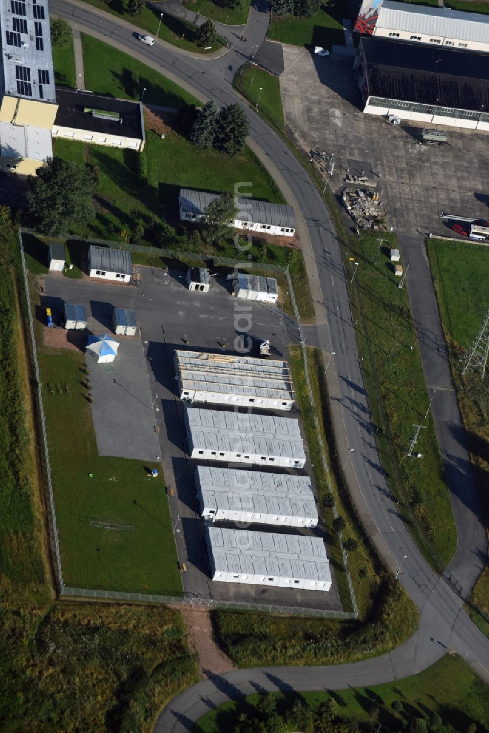 Aerial image Jahnsdorf Erzgebirge - Container settlement as temporary shelter and reception center for refugees at the airfield in Jahnsdorf Erzgebirge in the state Saxony