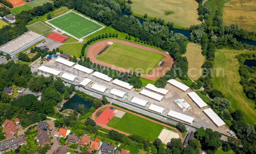 Aerial image Mülheim an der Ruhr - Construction site for the new building of Asylum accommodation buildings place Saarner Kirmesplatz on Stadium in Muelheim an der Ruhr in the state North Rhine-Westphalia