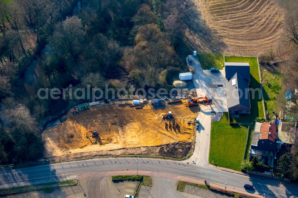 Isselburg from the bird's eye view: Construction site for the new building of Asylum accommodation buildings adjacent to the fire station on Stromberg in Isselburg in the state of North Rhine-Westphalia