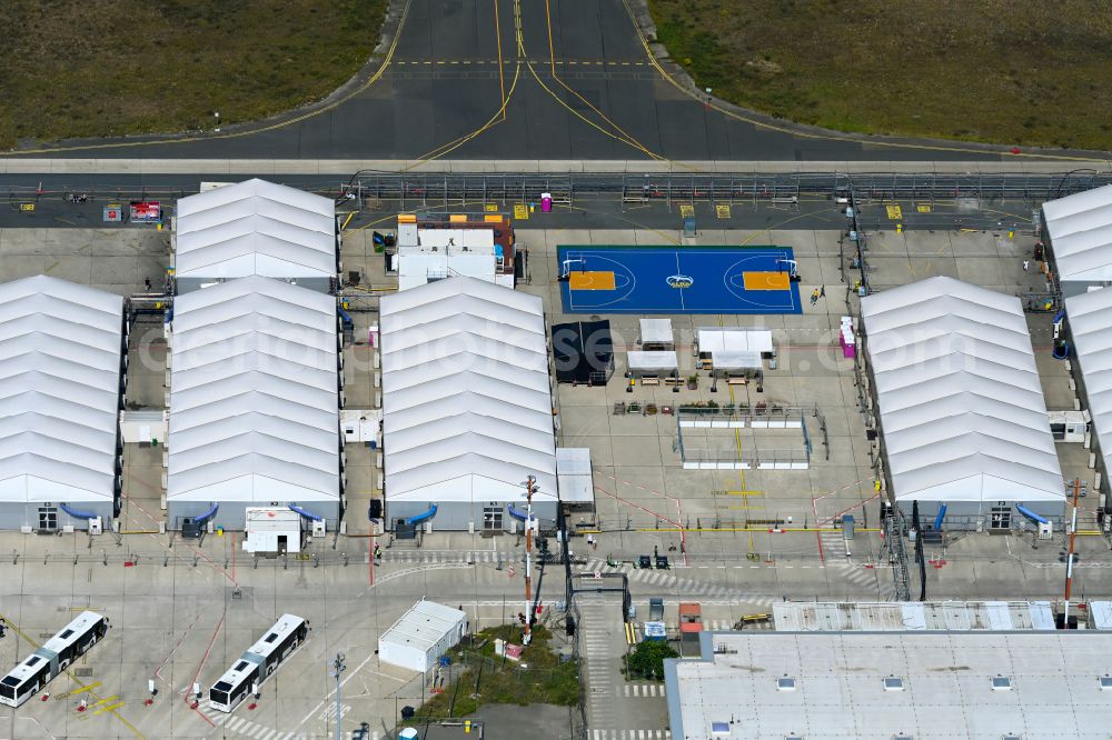 Aerial image Berlin - Home and asylum accommodation tent camp as makeshift accommodation Ukraine Arrivals Center TXL in the district of Tegel in Berlin, Germany