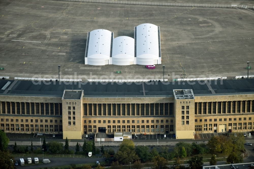 Aerial photograph Berlin - Premises of the former airport Berlin-Tempelhof Tempelhofer Freiheit in the Tempelhof part of Berlin, Germany. Its hangars are partly used as refugee and asylum seekers accommodations