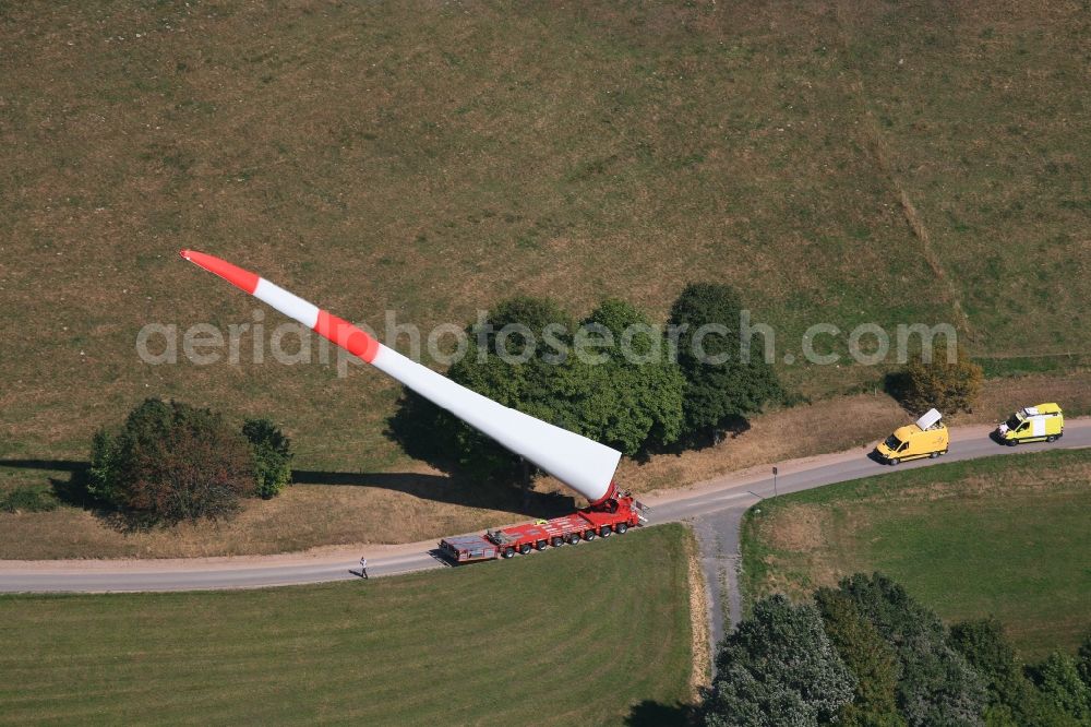 Schopfheim from above - A rotor blade of a wind turbine is moved to the construction site on the Rohrenkopf near Gersbach in Schopfheim in the state Baden-Wuerttemberg