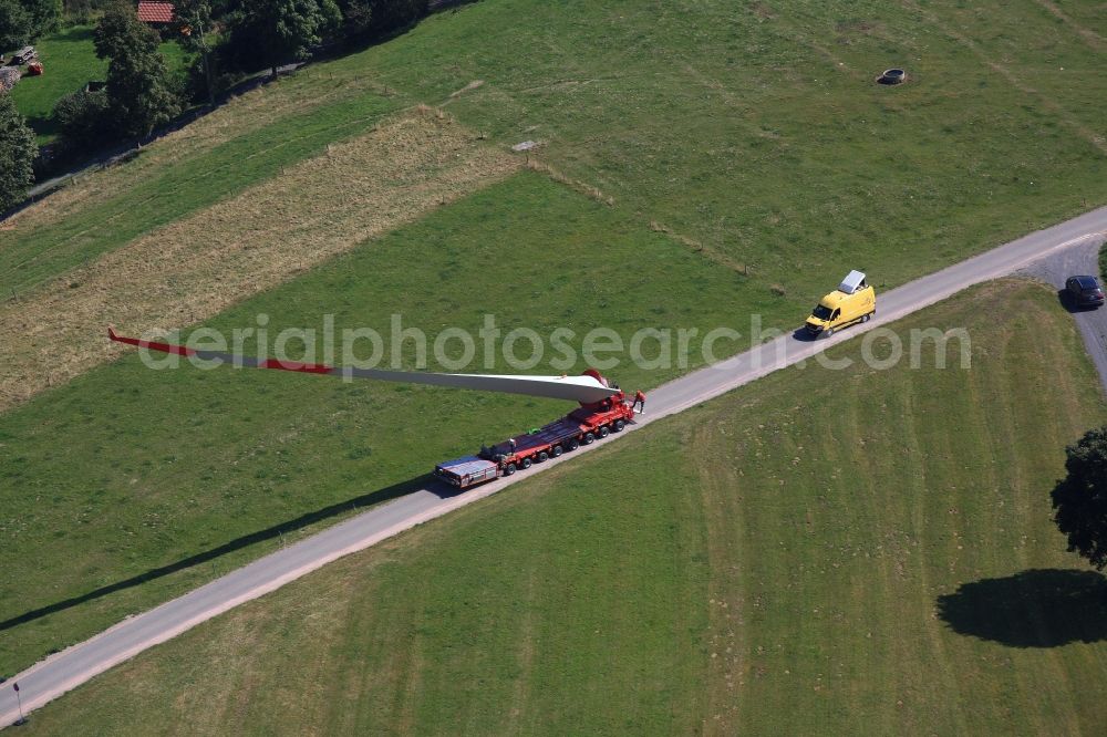 Schopfheim from above - A rotor blade of a wind turbine is moved to the construction site on the Rohrenkopf near Gersbach in Schopfheim in the state Baden-Wuerttemberg