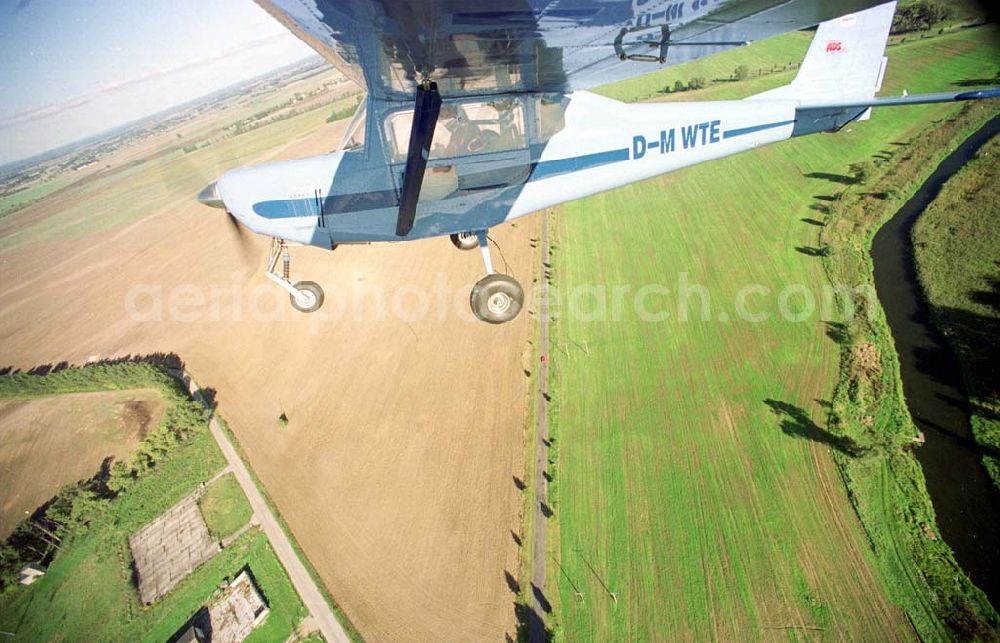 Aerial photograph Neuhardenberg / Brandenburg (ehem. Marxwalde) - Flug mit einem Ultraleichtflugzeug WT-02 in der Platzrunde des Flugplatzes Neuhardenberg (ehem. Marxwalde) im Bundesland Brandenburg.