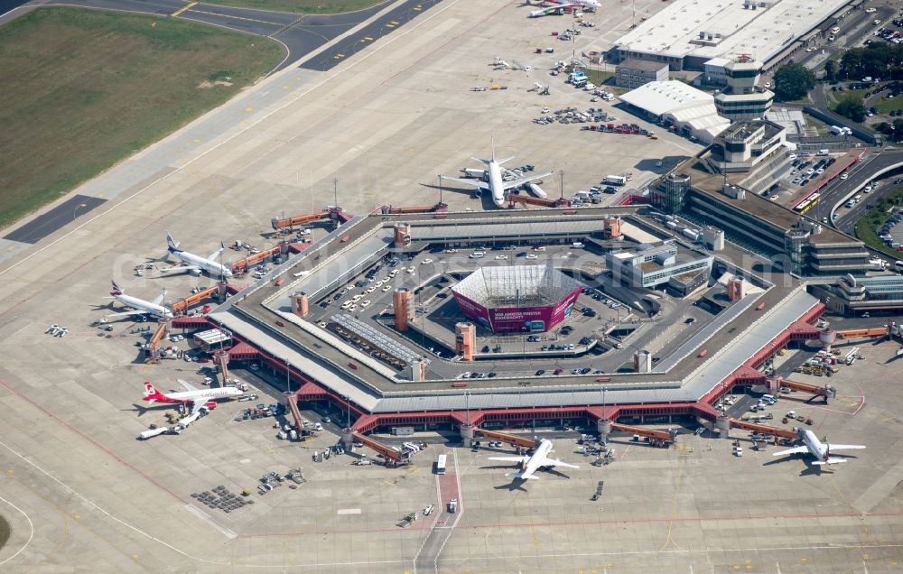 Berlin from the bird's eye view: Flight operations at the terminal of the airport Berlin - Tegel