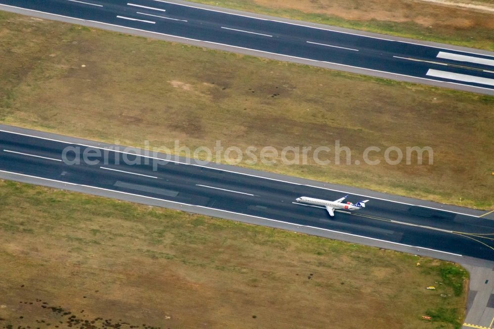 Berlin from the bird's eye view: Flight operations at the terminal of the airport Berlin - Tegel