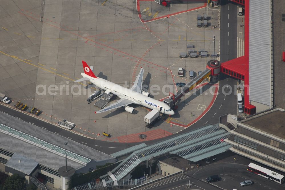 Berlin from above - Flight operations at the terminal of the airport Berlin - Tegel