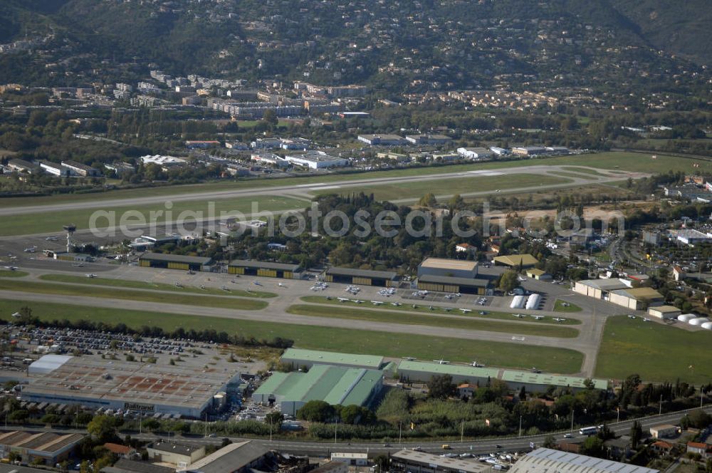 Aerial photograph Cannes - Blick auf den Flughafen Cannes - Mandelieu / Aéroport de Cannes - Mandelieu. Der Flughafen befindet sich ca 5km westlichen von Cannes, sowie östlich von Mandelieu la Napoule. International ist er weniger bedeutend, denn der Hauptflugverkehr wird im Flughafen von Nizza abgefertigt. Kontakt: Aéroport Cannes Mandelieu, Avenue Francis Tonner, 06150 Cannes, Tel. +33(0)8 20 42 66 66